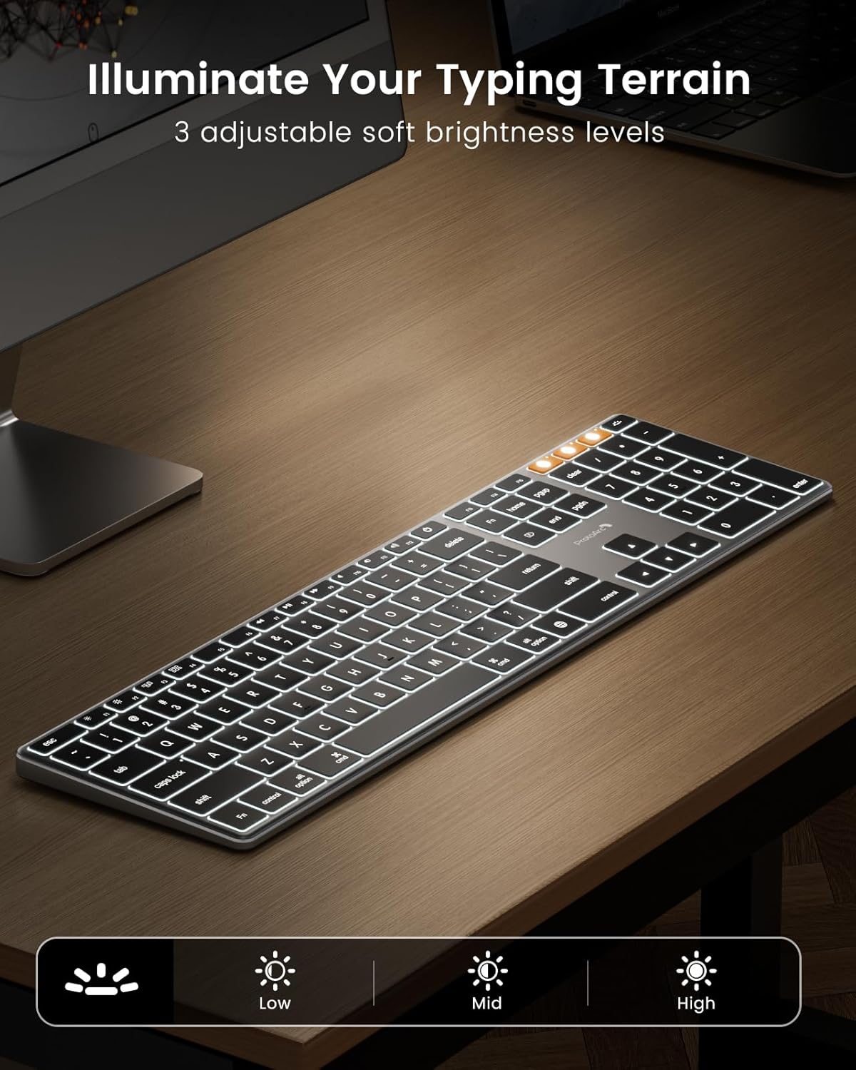 ProtoArc K110-A slim aluminum Bluetooth keyboard with adjustable white LED backlighting on a wooden desk.