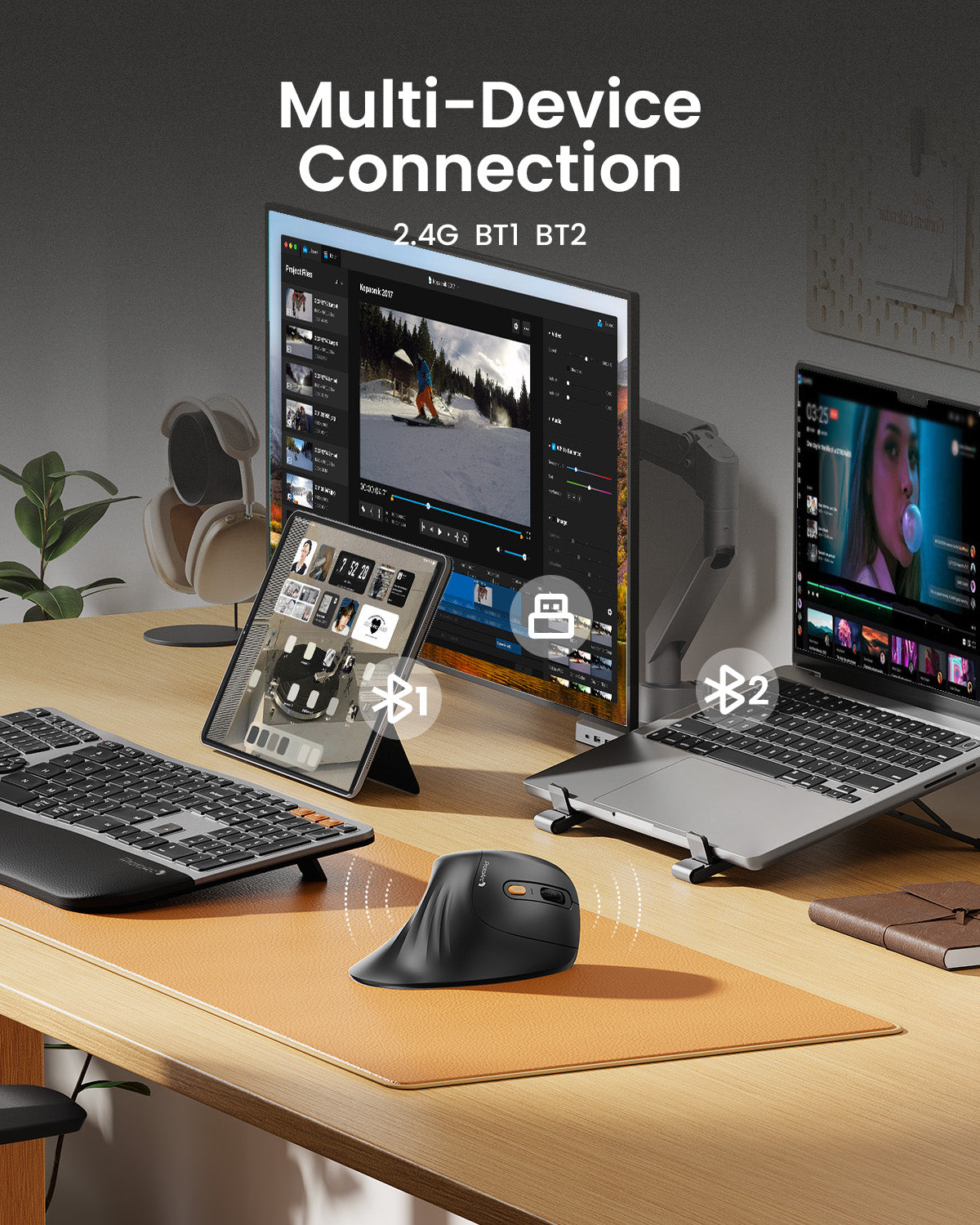 Black ergonomic vertical mouse shown connecting to a laptop and tablet for multi-device use on a desk. EM11 NL.
