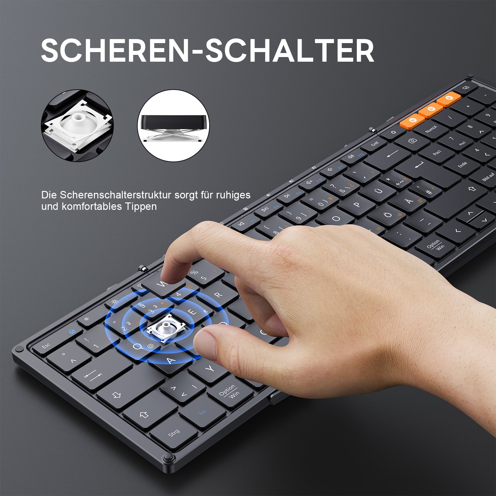 Black XK01 Tri-Fold Keyboard DE layout. Finger presses key, showing scissor switch for quiet typing. Orange function keys.