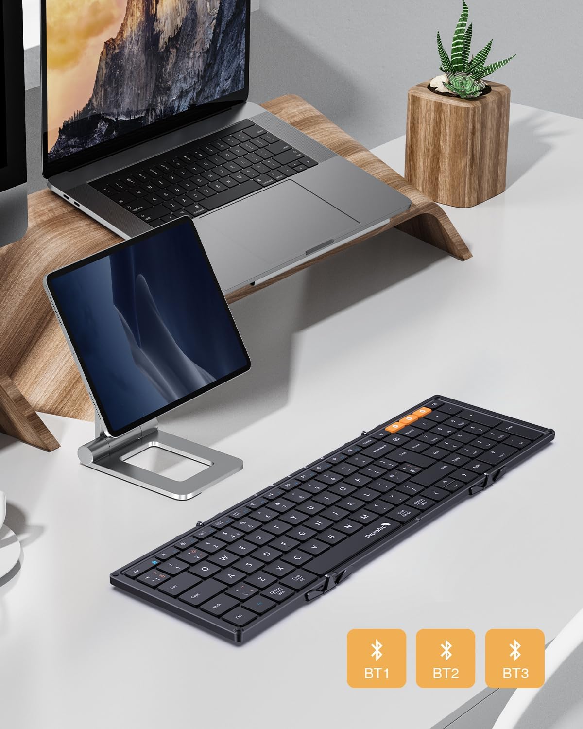 XK01 Tri-Fold Bluetooth Keyboard UK layout with laptop and tablet for versatile portable workstation setup.