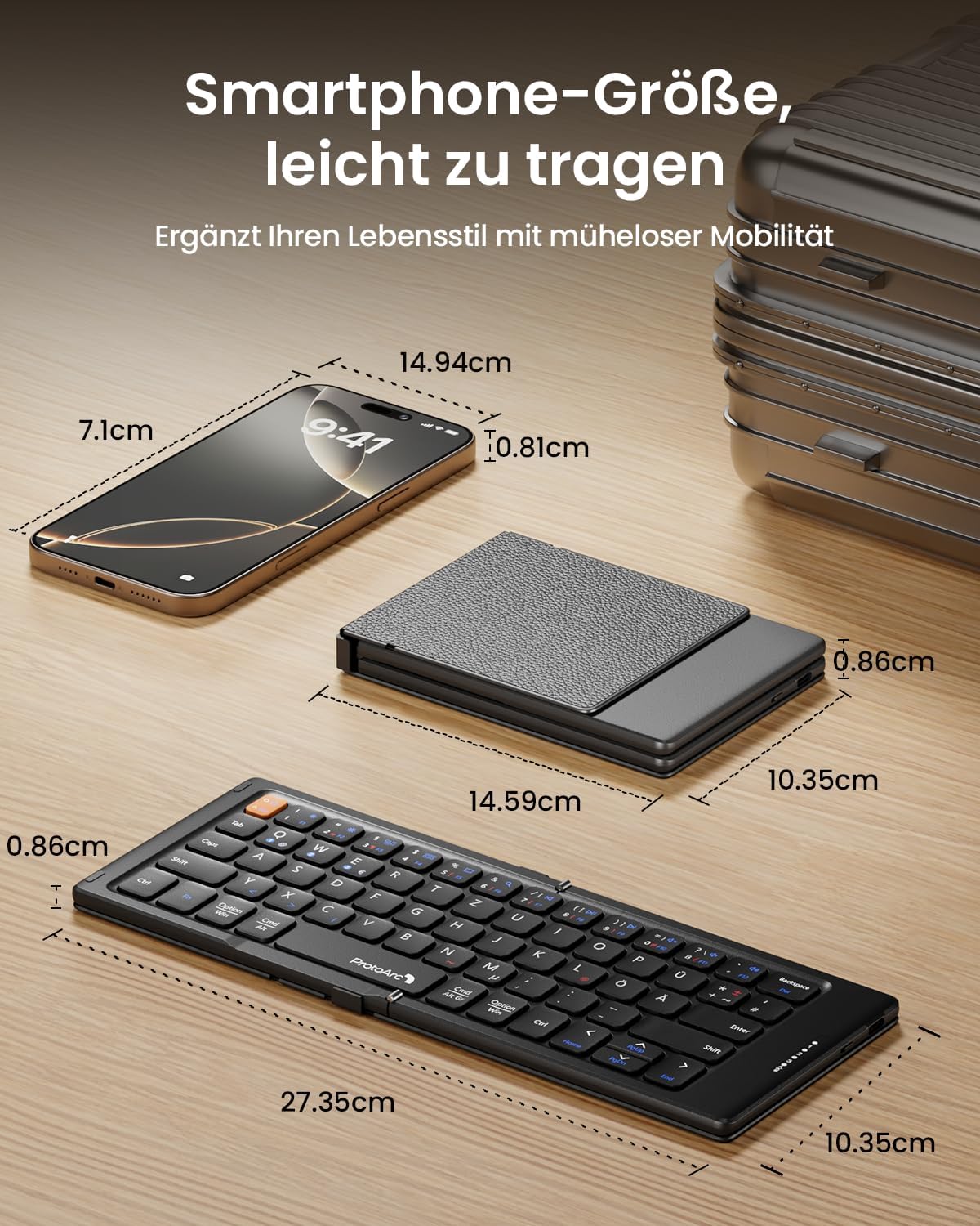 XK04 foldable compact Bluetooth keyboard (DE layout) next to smartphone for size. Expanded keyboard measures 27.35cm.