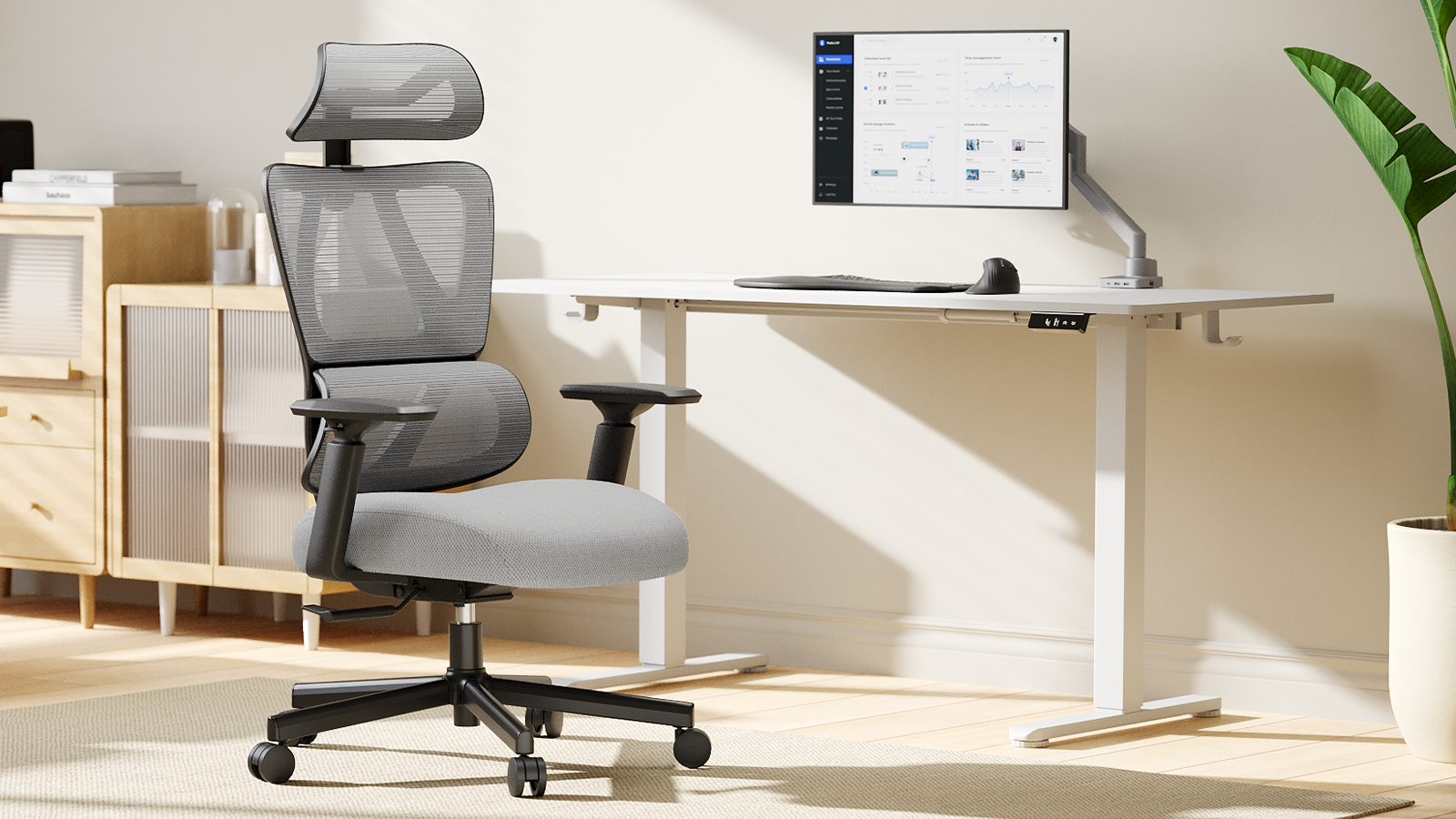 Modern ergonomic office setup with a mesh chair and adjustable desk.