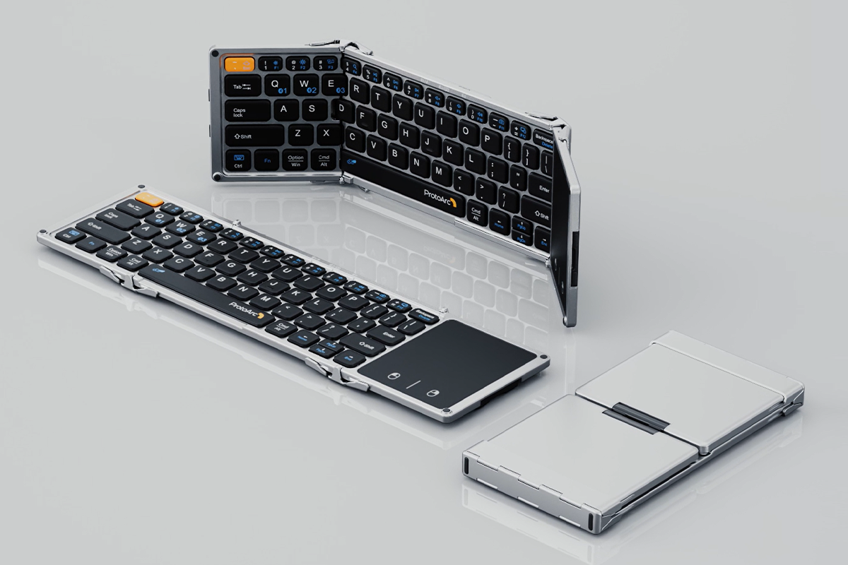 A silver folding keyboard shown in its folded, unfolding, and fully open states.