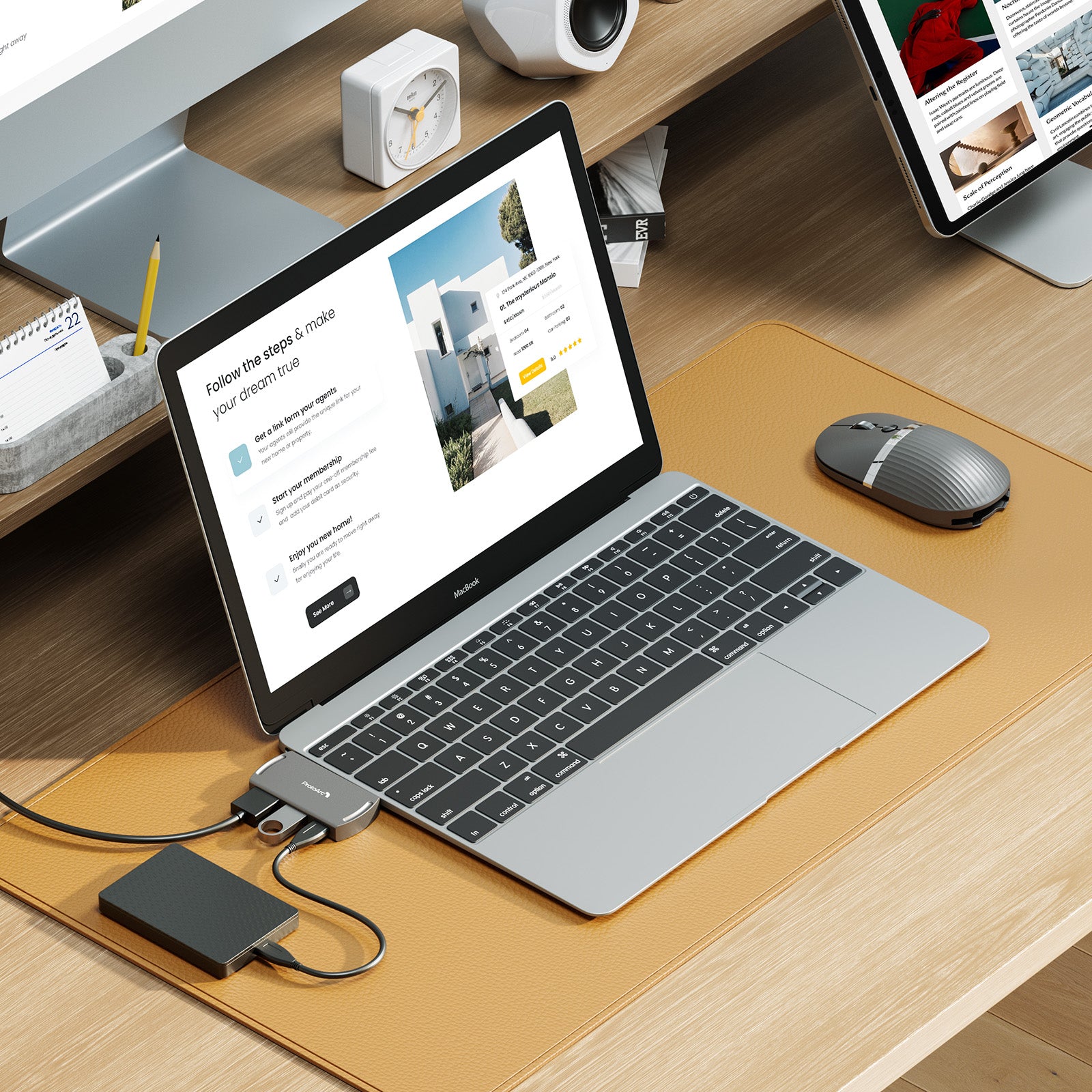ProtoArc 2-in-1 Hub Mouse connected to MacBook with external drive. Portable workspace setup.