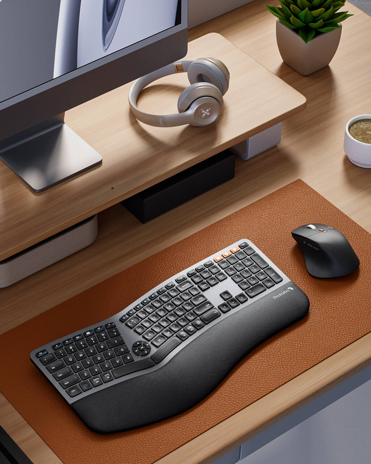EKM01 Plus ergonomic split keyboard and mouse, dark gray, cushioned wrist rest, orange keys on desk mat.