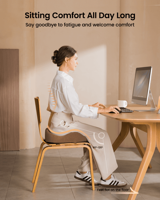 Woman sitting at desk using SC Butterfly seat cushion, promoting ergonomic posture and comfort for all-day sitting.
