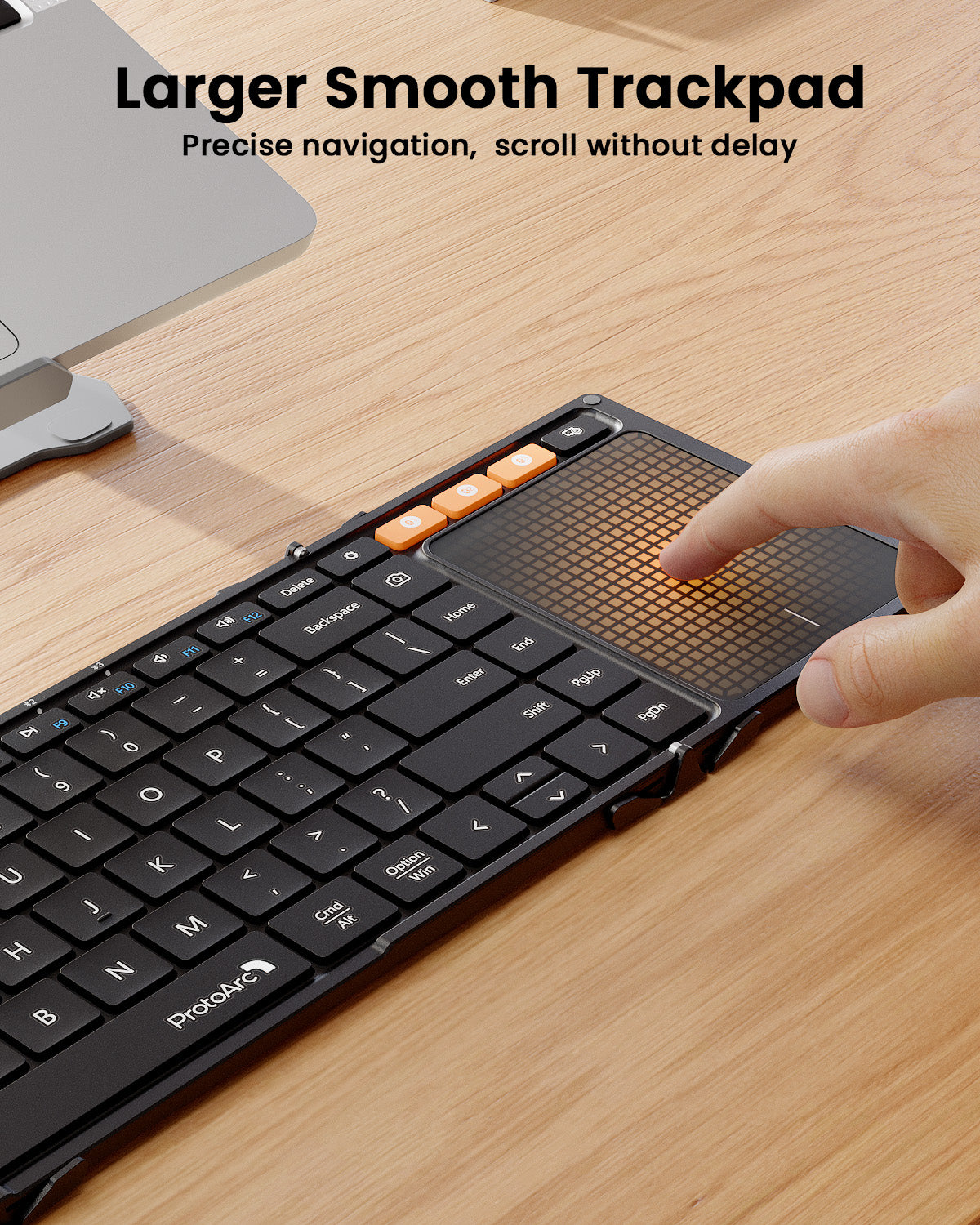 ProtoArc XK01 TP foldable keyboard with touchpad. Hand uses large trackpad. Text: Larger Smooth Trackpad.
