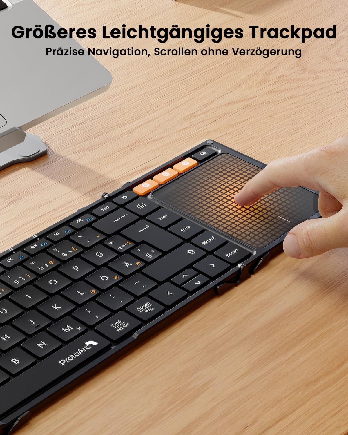 Black foldable DE QWERTZ keyboard with large touchpad, finger demonstrating navigation.