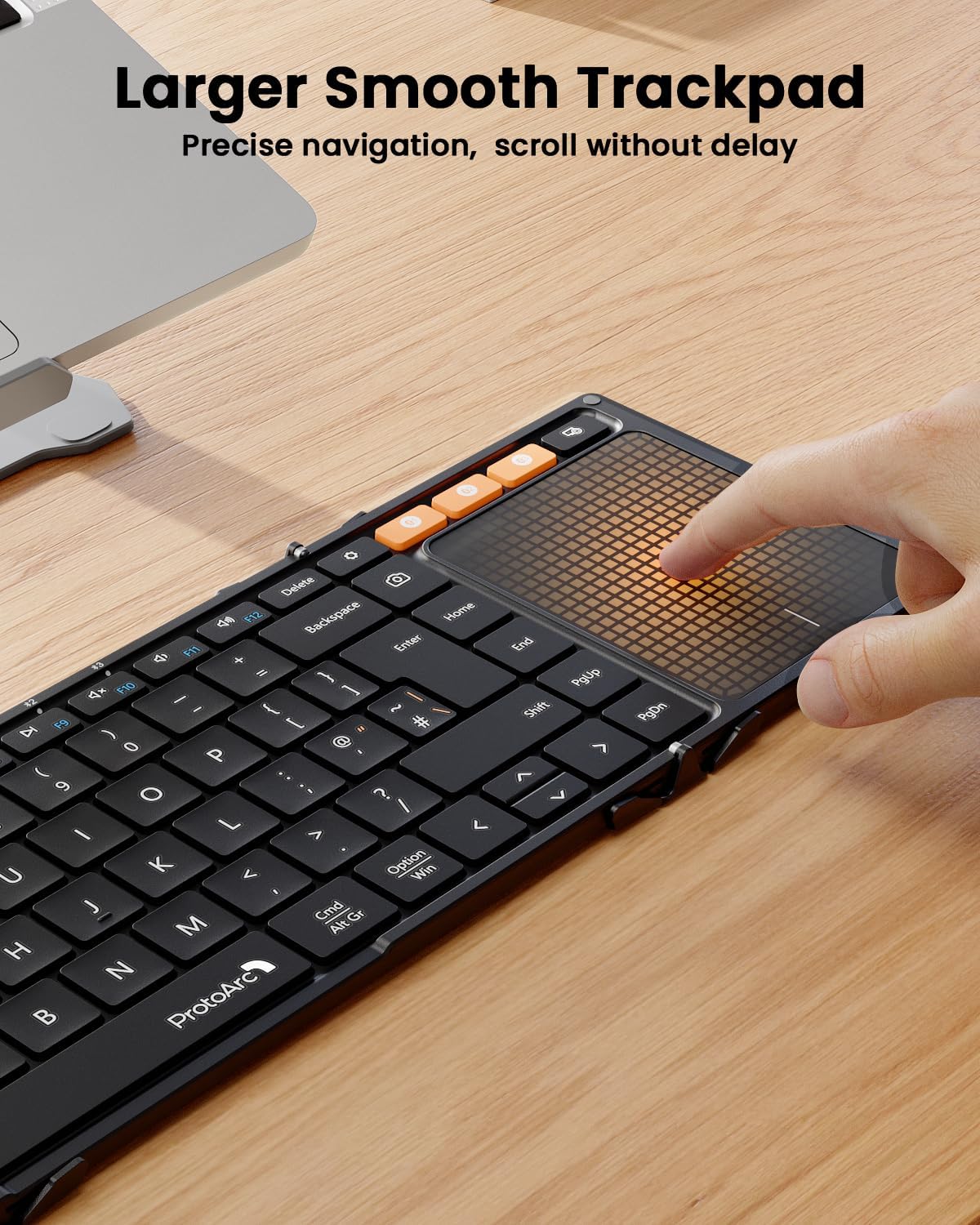 XK01 TP foldable Bluetooth keyboard with touchpad, UK layout, demonstrating precise navigation on its large smooth trackpad.