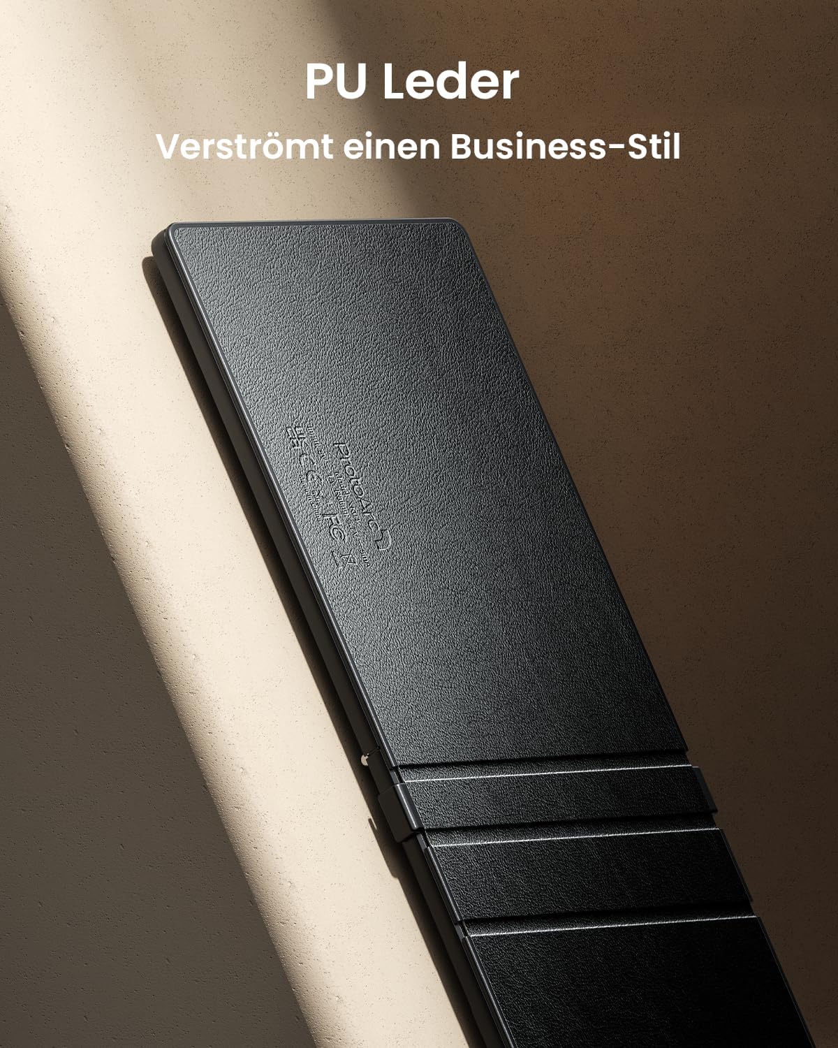 Black foldable Bluetooth keyboard with PU leather finish, featuring DE layout.